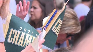 Bucks fans celebrate team's championship win during parade