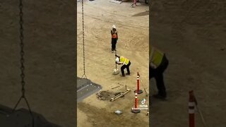 Worker stabs a propane tank with a rod