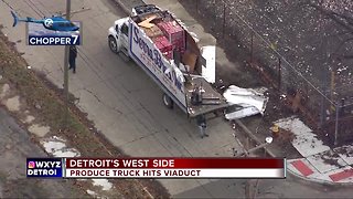 Produce truck hits viaduct in Detroit, rips off roof