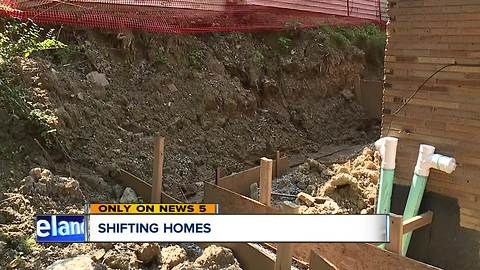 Work to fix housing code violations is left unfinished after removing a retaining wall