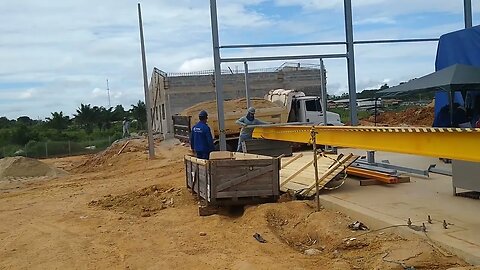 Wärtsilä... Hauling sand to the site...