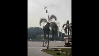 In Malaysia, two military helicopters collide in mid-air and plunge to the ground