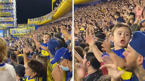 Little Boy Proudly Cheers For His Team With All The Fans