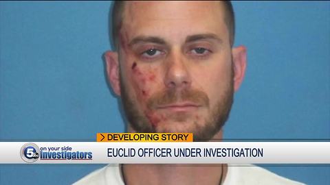 Euclid cop charged with pulling a gun during bar fight