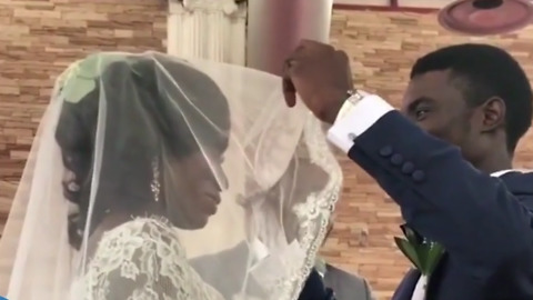 Groom Lifts the Bride's Veil to Kiss Her — But This Clip of His Reaction Has Now Gone Viral