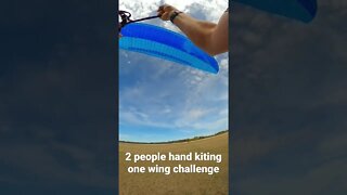 2 people hand kiting 1 wing challenge