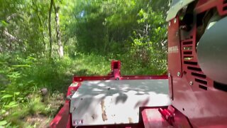 Ventrac 4500Y diesel mowing a trail in the woods.