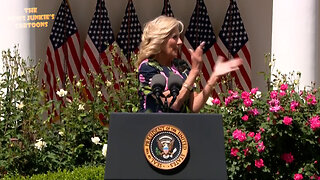 Laughing & clapping "doctor" Jill warms up the audience before another of Joe's teleprompter reading.