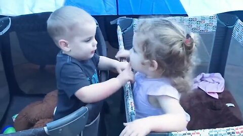 Two babies hugging each other - cute babies video