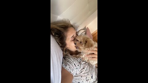 A puppy and her owner say good morning like this