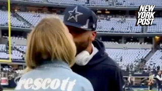 Dak Prescott and girlfriend Natalie Buffett share a kiss after Cowboys win