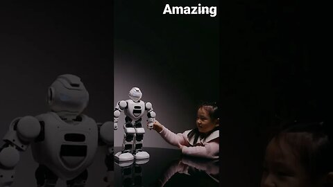 Little girl is playing with robot.