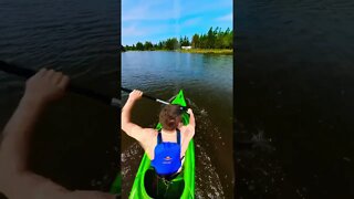 Kayaking fast through a river