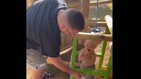 Boy loves the wooden elevator his dad made for him