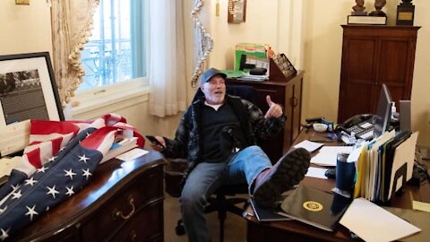 Man pictured with foot on desk in Pelosi's office is arrested