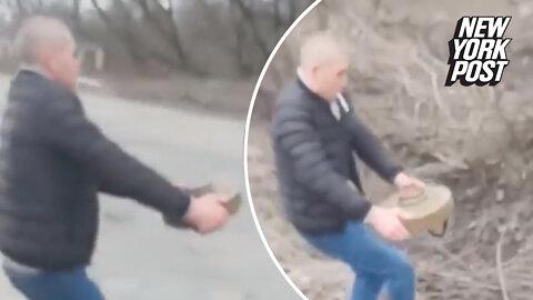 Ukrainian man removes mine from roadway while smoking cigarette: video