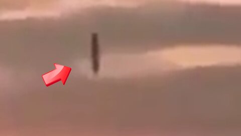 Stick-shaped UFO enters the sea from a cloudy sky [Space]