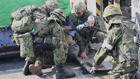 MCAS Iwakuni Marines and JGSDF Soldiers conduct a mass casualty evacuation