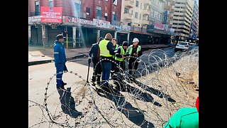 Police and other officials asses damage following the explosion that rocked Joburg cbd on Wednesday