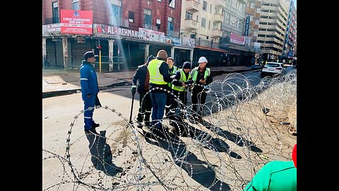 Police and other officials asses damage following the explosion that rocked Joburg cbd on Wednesday