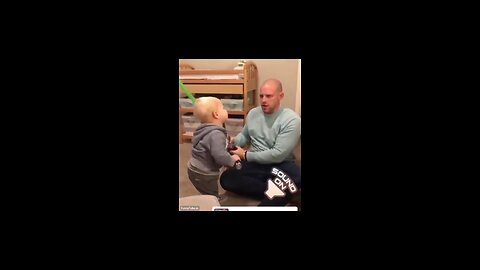 Cute baby playing with his father