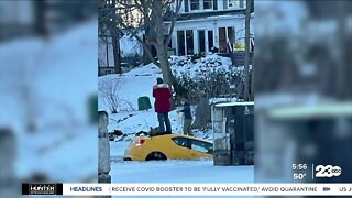 Woman poses for selfie atop sinking car after trying to drive on frozen river in Canada