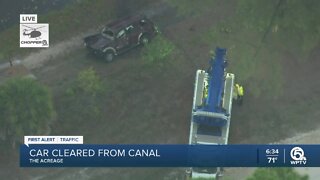 Man hospitalized after crashing into canal in Palm Beach County