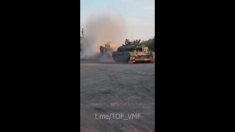 T-80BVM tank of the Russian Armed Forces towing the captured Ukrainian Husky TSV armored vehicle