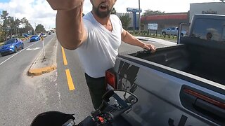 Motorcycle rider gets into a fight with Jeep driver