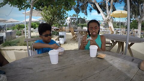 Blasian Babies Family Grab Some Drinks And Snacks At The Mission Bay Beach Club In Sun Diego, CA.