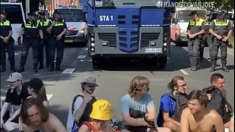 Police blasted a bunch Climate Change Activist away with a boat load of water! Must see! You
