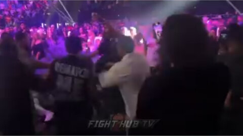 Caleb plant throws a drink at Ryan Garcia during the Tank Davis fight