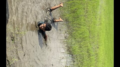 Little boy Swimming in Mud muck
