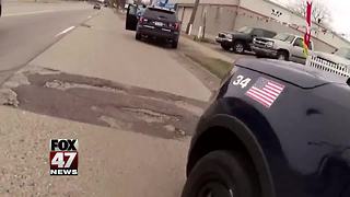 Video shows gunfire exchange with Lansing police