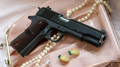 Springfield Mil Spec 1911, the prefect purse pistol for ladies.