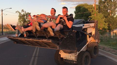 Crazy thrill ride in bucket of Bobcat loader