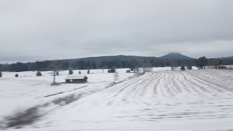 Winter train-ride through Hälsingland along Ljusnan, Sweden