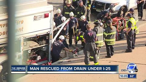 Man stuck in storm drain under I-25 was rescued after drivers saw a hand sticking out of grate