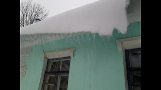 Snow and ice sliding down from the roof