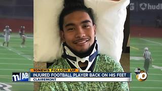 Injured football player back on his feet
