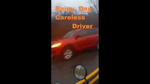 Rainy day close call on Honda Grom Motorcycle. SUV pulls out in front of motorcyclist