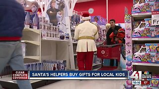 Santa's helpers buy gifts for local children