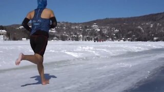 Barefoot runner attempts world record half-marathon on frozen Quebec lake