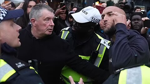 Moment police hold back counter protesters after one arrested