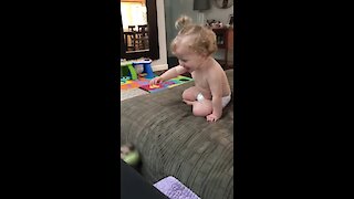 Baby Girl Can't Stop Laughing As She Plays Fetch With Dog