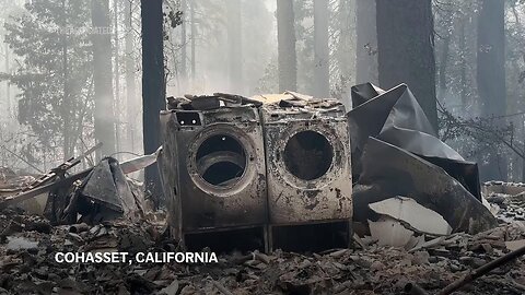 Devastation and smoke rise from the ashes of California wildfires