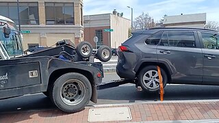 Transit Police towing a vehicle because it's parked over the solid line