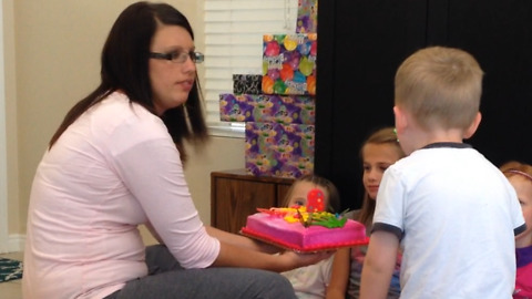 A Little Boy Slaps A Birthday Girl In The Face