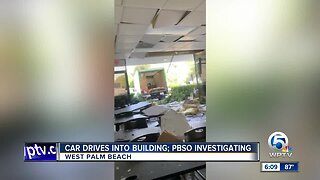 Car drives into building in West Palm Beach
