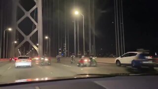 Bikers riding in the wrong direction on the Golden Gate Bridge